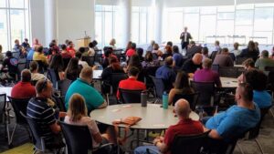 CIO Dr. Marc Hoit welcomes OIT staff back to campus last July in the James B. Hunt Jr. Library.