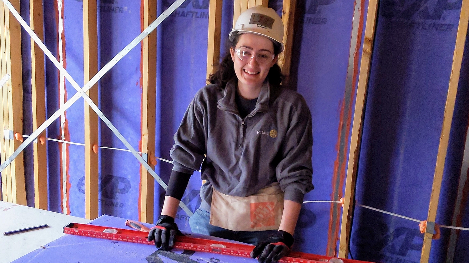 Project Management Lite intern Liz Roach lends a hand at the Habitat for Humanity event.