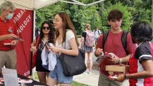 Stan North Martin and Mardecia Bell talk with students at the Campus Department Fair.