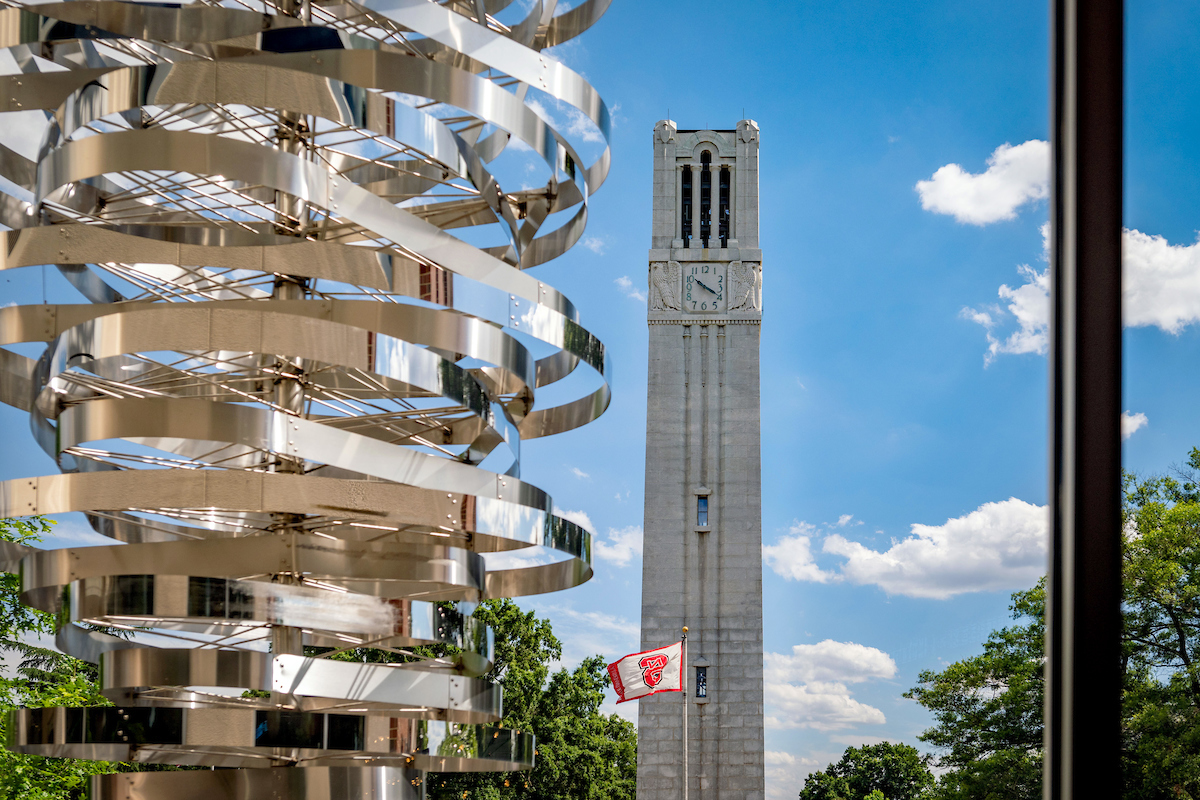 NC State's Memorial Belltower stands in front of a clear summer sky on a June afternoon. Photo by Becky Kirkland.