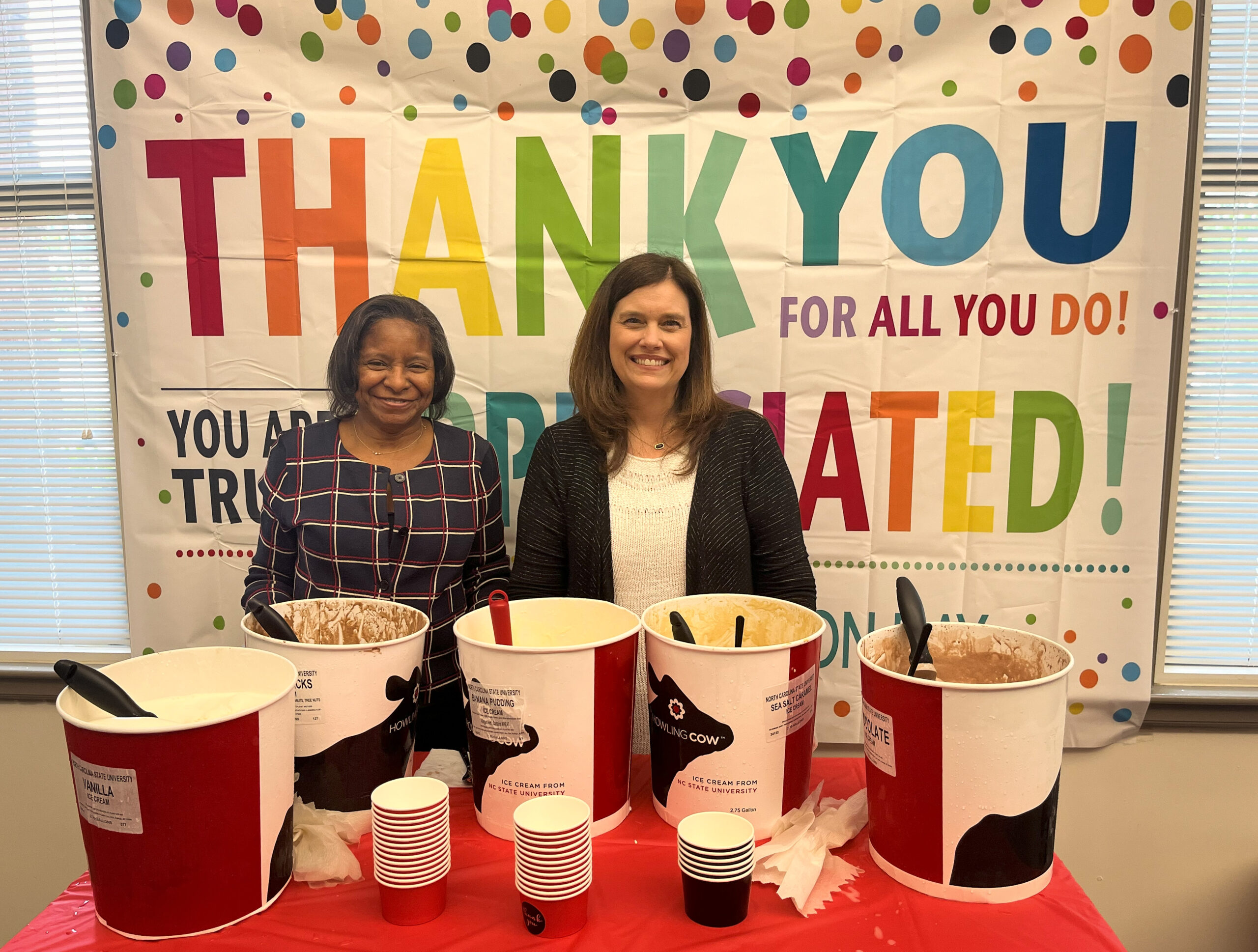 Mardecia Bell and Karen Horne serve ice cream to OIT staff to celebrate Employee Appreciation Week.