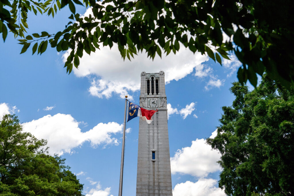 The state flag flies in the breeze in front of the Memorial Belltower. Photo by Becky Kirkland.